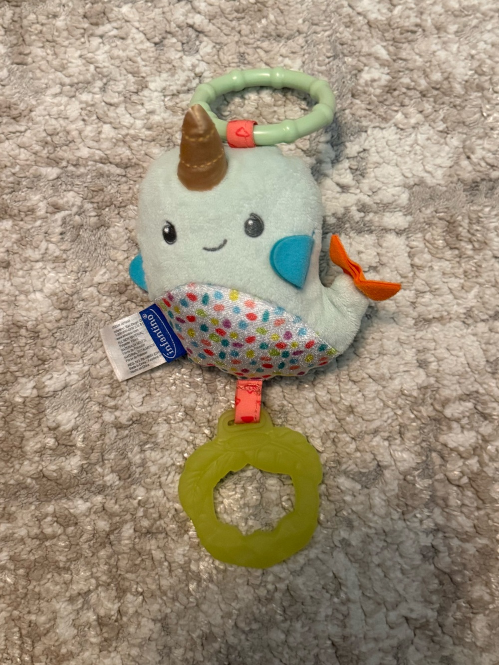 Infantino Mint Plush Narwhal Rattle with Orange Fin and Green Teether
